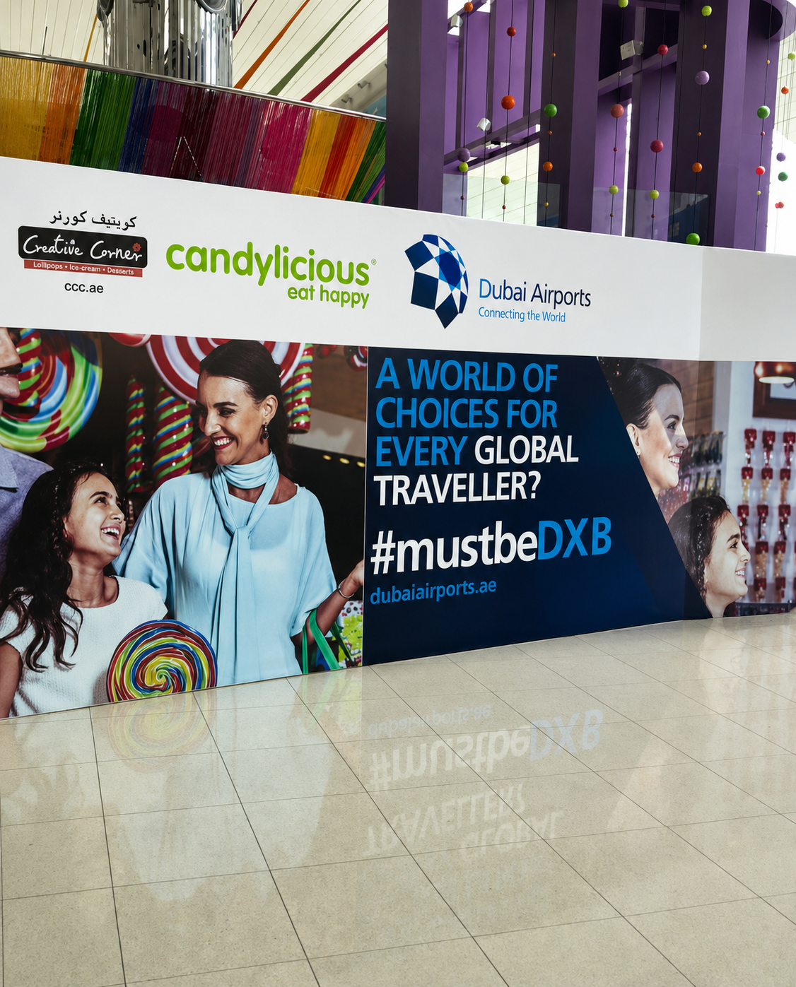 Commercial campaign imagery displayed at Dubai Airports